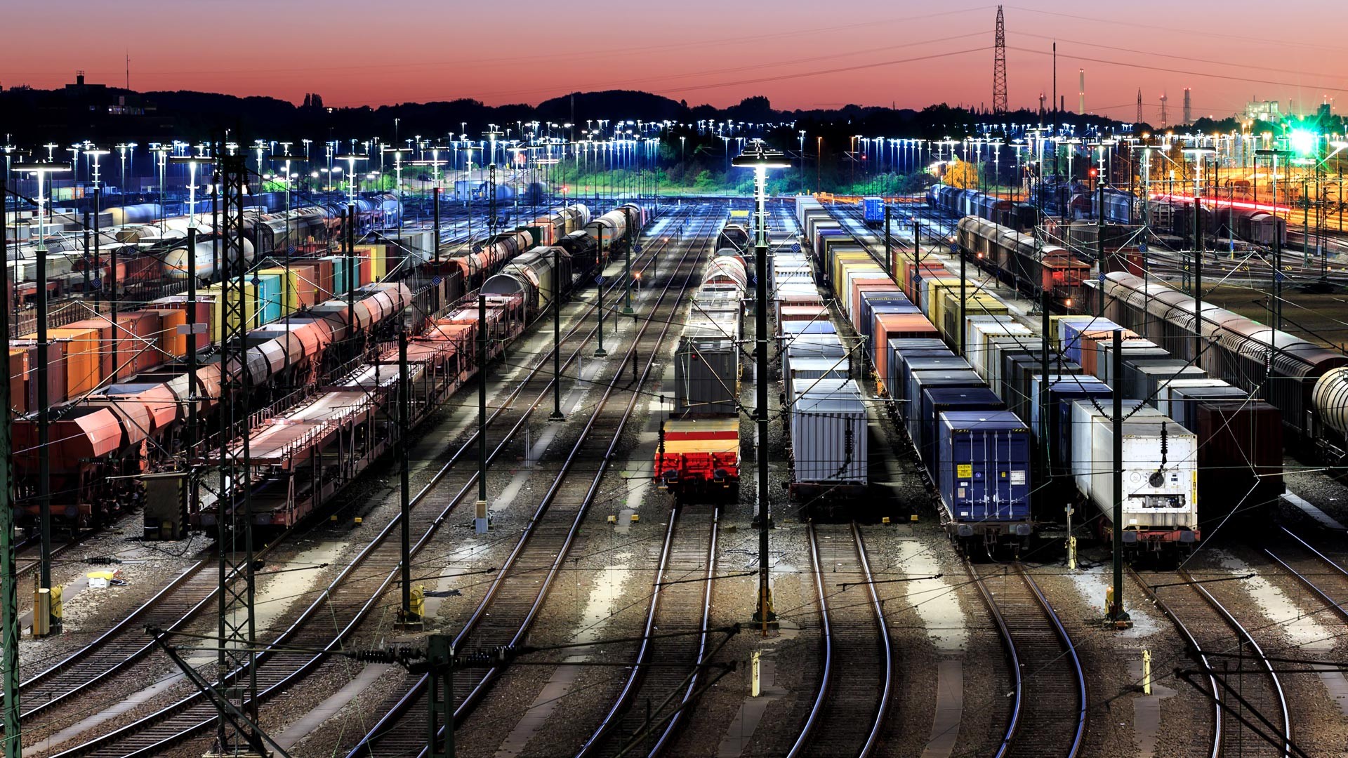 illuminated-freight-tain-station-in-evening-mood