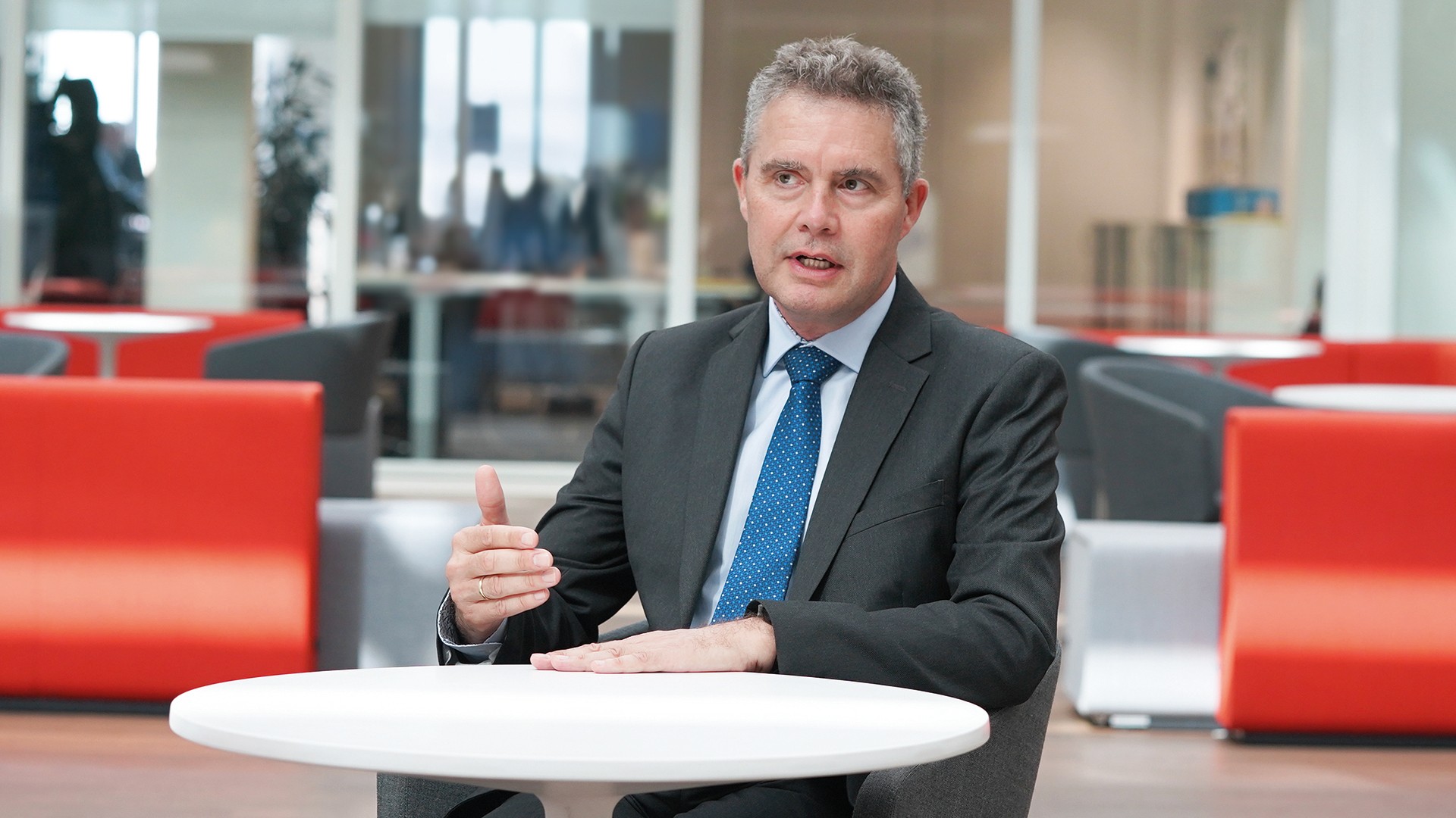 Dr. Jonathan Paddison, Member of the Executive Board of Knorr-Bremse Asia Pacific, based in Hong Kong, China, sits in the lounge area at the company's headquarters in Munich and answers interview questions.