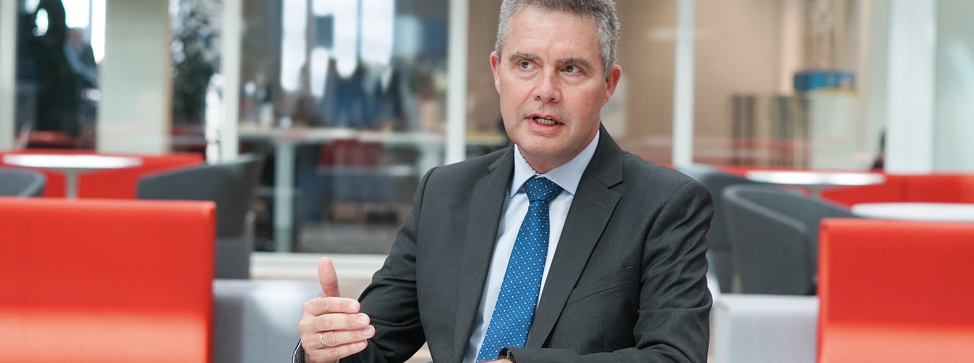 Dr. Jonathan Paddison, Member of the Executive Board of Knorr-Bremse Asia Pacific, based in Hong Kong, China, sits in the lounge area at the company's headquarters in Munich and answers interview questions.