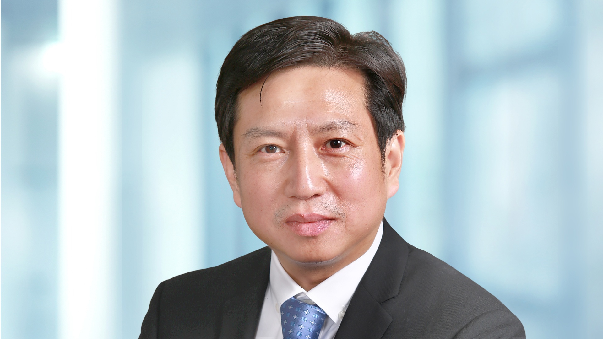 Portrait photo of Frank Qian, who heads the main Rail facility of Knorr-Bremse in Suzhou.