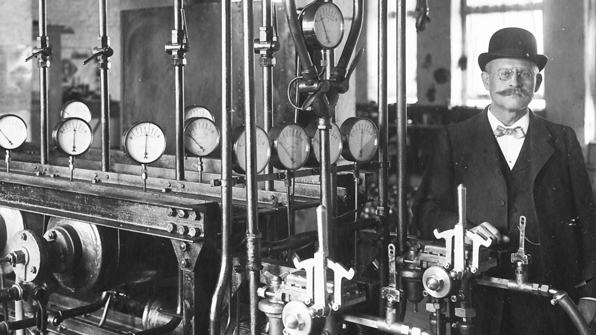 Historic test rig for passenger train brakes featuring multiple gauges and mechanical components