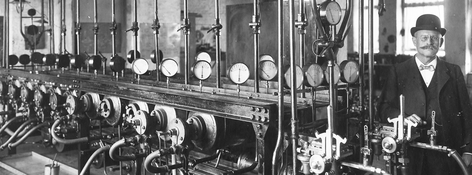 Historic test rig for passenger train brakes featuring multiple gauges and mechanical components