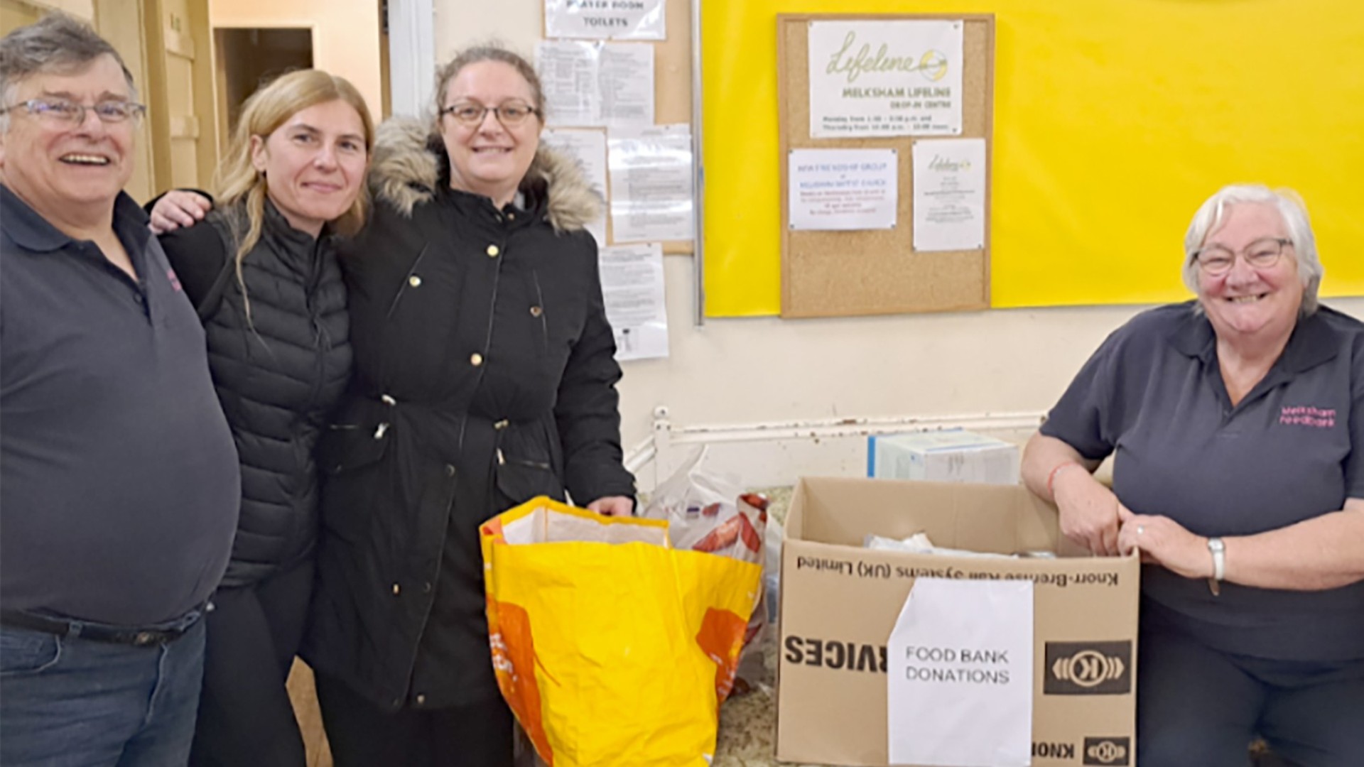 Employees from Melksham with donated food items for the Melksham Foodbank to support people in need in the local community
