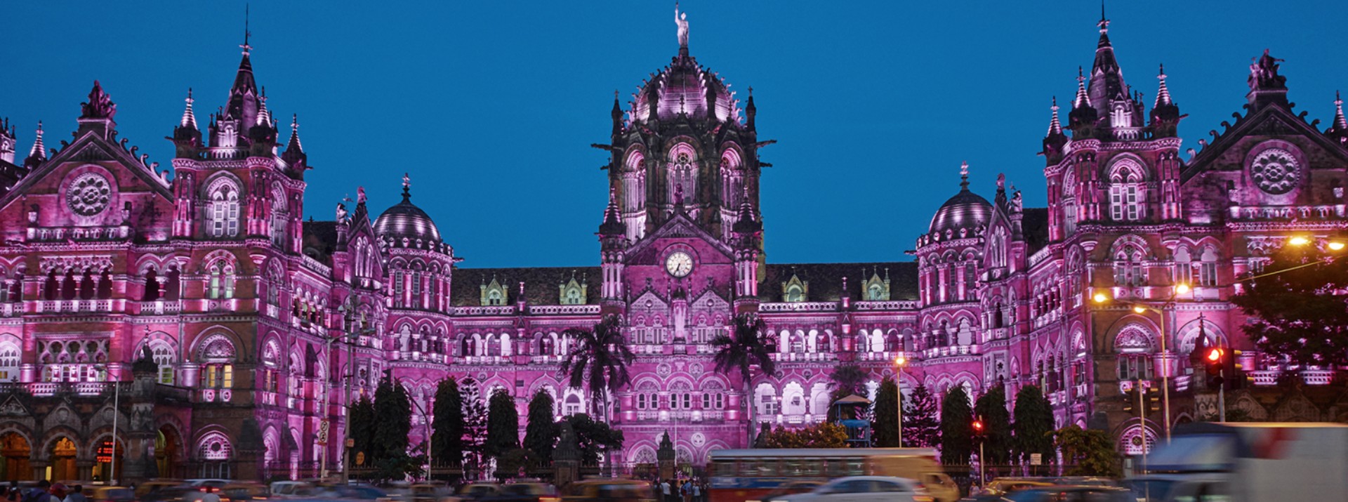 The historic Chhatrapati Shivaji Terminus railway station in Mumbai, impressively illuminated at night – one of India’s busiest transportation hubs